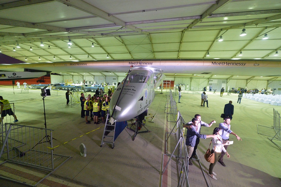 technicians inspect the solar powered solar impulse 2 aircraft at the cairo international airport in the egypt photo afp