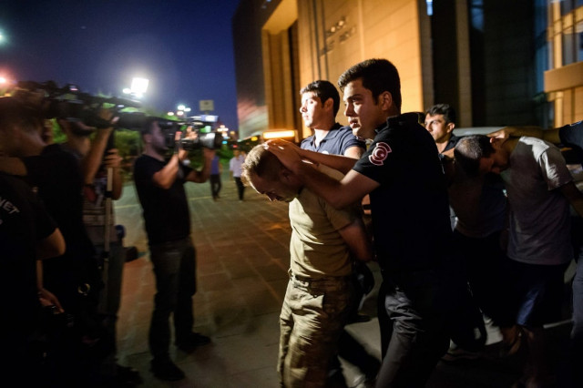 turkish anti riot police officers escort turkish soldiers who allegedly took part in a military coup as they are leaving the courthouse at bakirkoy district in istanbul on july 16 2016 photo afp turkish anti riot police officers escort turkish soldiers who allegedly took part in a military coup as they are leaving the courthouse at bakirkoy district in istanbul on july 16 2016 photo afp