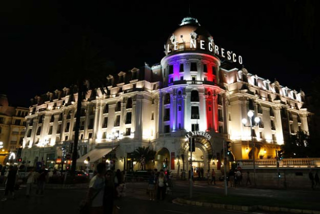 this photo taken on july 17 2016 on the promenade des anglais in nice shows the hotel negresco illuminated in the colours of france 039 s flag in tribute to the victims of the bastille day attack photo afp this photo taken on july 17 2016 on the promenade des anglais in nice shows the hotel negresco illuminated in the colours of france 039 s flag in tribute to the victims of the bastille day attack photo afp