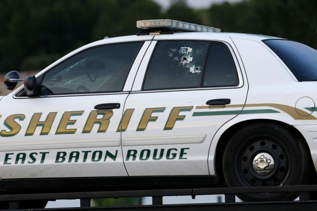 an east baton rouge sheriff vehicle is seen with bullet holes in its windows near the scene where police officers were shot in baton rouge photo reuters an east baton rouge sheriff vehicle is seen with bullet holes in its windows near the scene where police officers were shot in baton rouge photo reuters