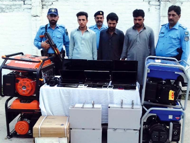 arrested robbers along with seized generators batteries and other equipment photo express