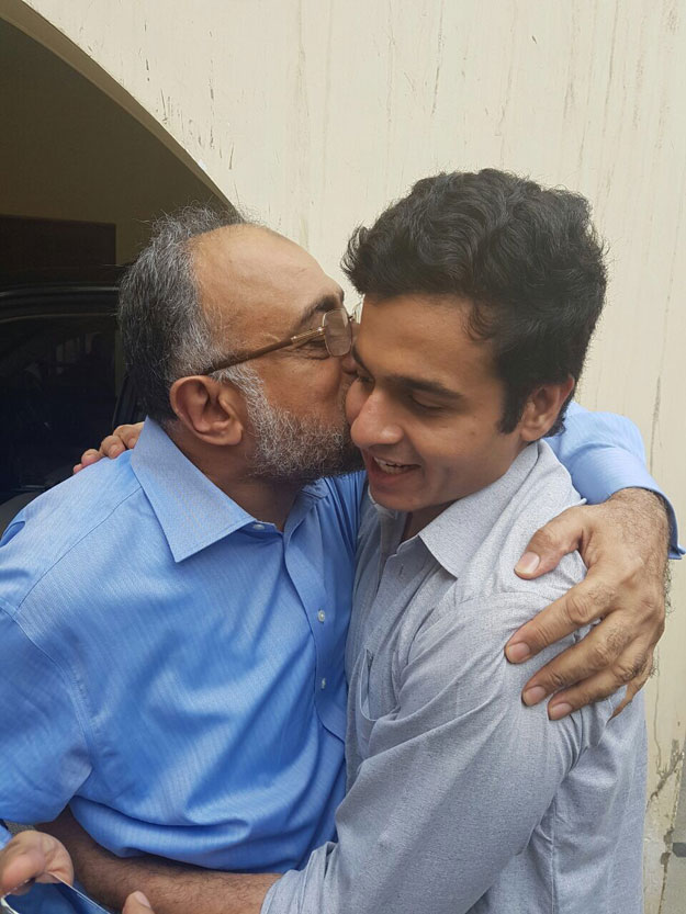 sindh high court cj hugs and kisses his son awais ali shah following the latter 039 s succesful recovery on tuesday photo ispr