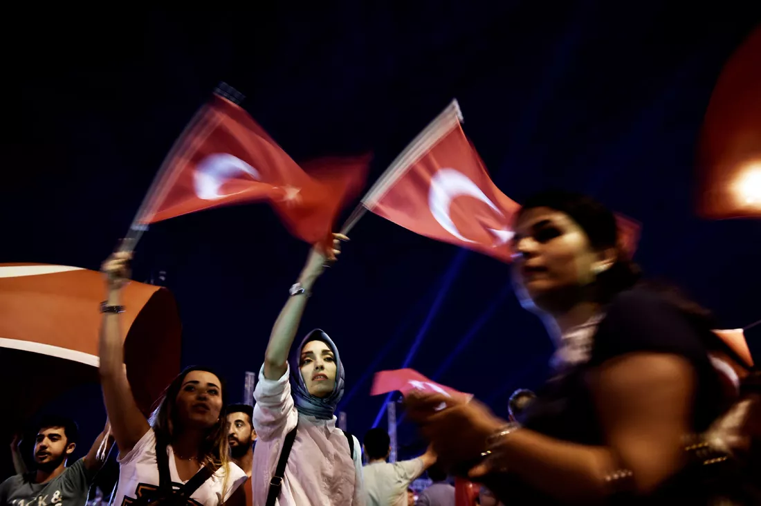 pro erdogan supporters wave turkish national flags during a rally at taksim square in istanbul on july 18 2016 following the military failed coup attempt of july 15 photo afp pro erdogan supporters wave turkish national flags during a rally at taksim square in istanbul on july 18 2016 following the military failed coup attempt of july 15 photo afp