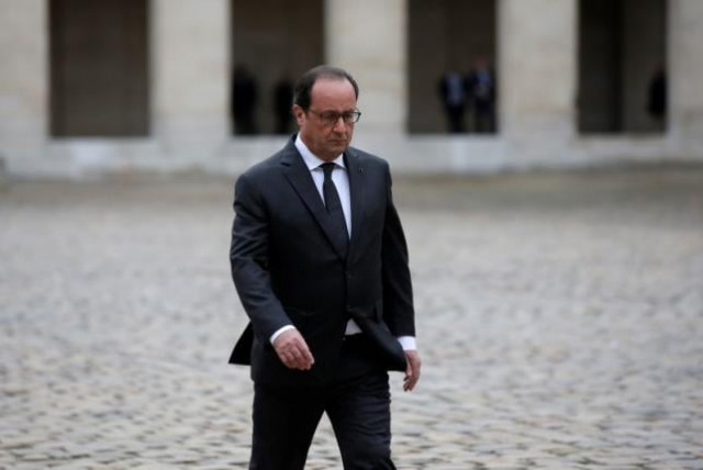 french president francois hollande walks in the courtyard of the hotel des invalides photo reuters