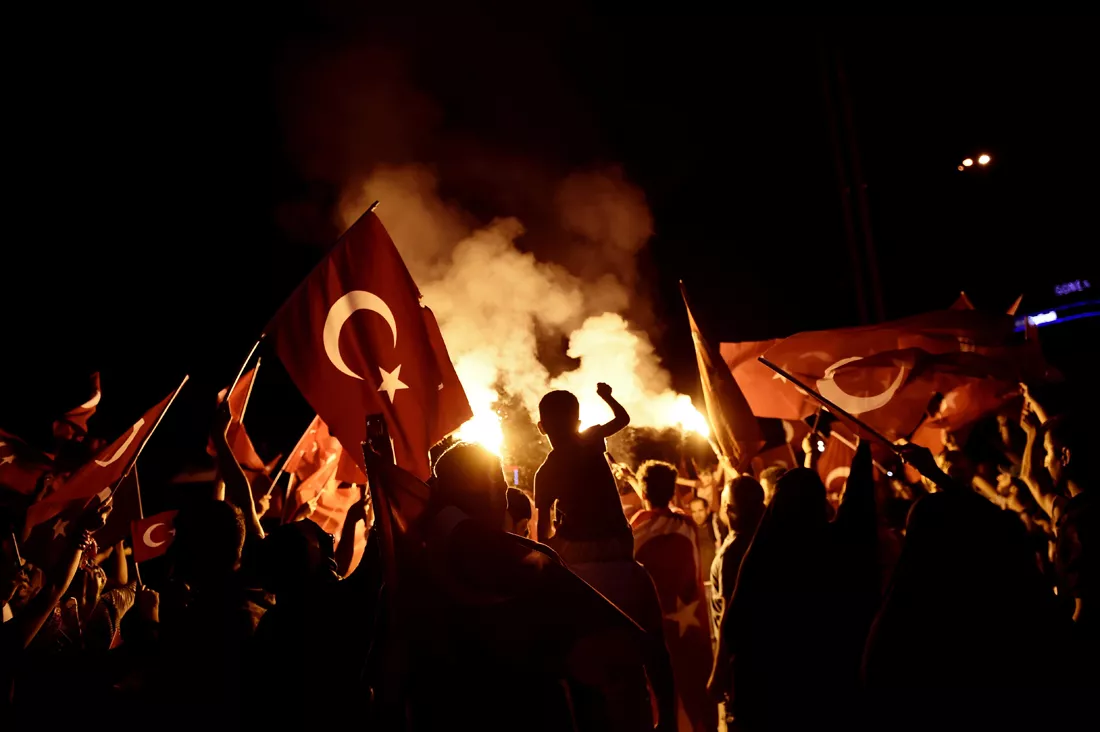 pro erdogan supporters wave national flags as they chant slogans during a rally at taksim square in istanbul on july 18 2016 following the military failed coup attempt of july 15 photo afp pro erdogan supporters wave national flags as they chant slogans during a rally at taksim square in istanbul on july 18 2016 following the military failed coup attempt of july 15 photo afp