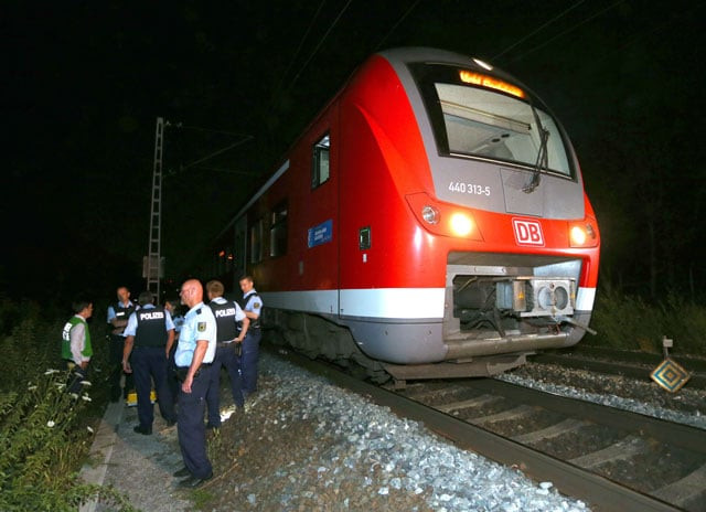 police officers stand by a regional train in wuerzburg southern germany on july 18 2016 after a man attacked train passengers with an axe photo afp police officers stand by a regional train in wuerzburg southern germany on july 18 2016 after a man attacked train passengers with an axe photo afp