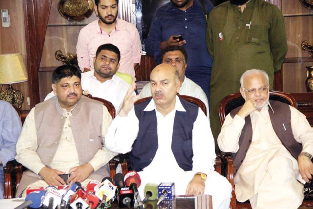 pti leaders at the press conference on tuesday photo express pti leaders at the press conference on tuesday photo express