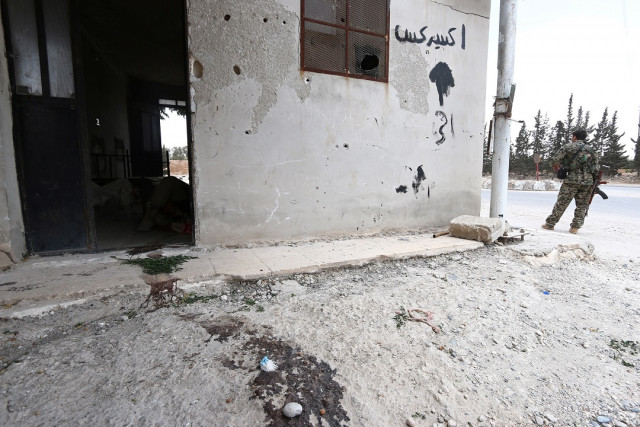 a fighter from the syria democratic forces sdf stands near the entrance to a room with a dead islamic state fighter on the ground photo reuters a fighter from the syria democratic forces sdf stands near the entrance to a room with a dead islamic state fighter on the ground photo reuters