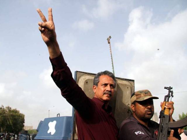 waseem akhtar makes a victoru sign as he is being shifted to karachi central jail on tuesday photo express