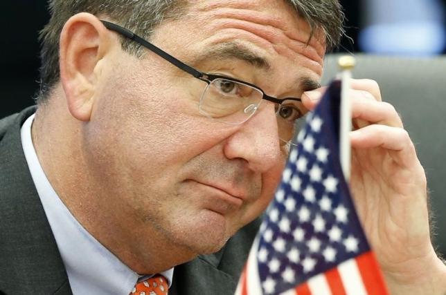 us deputy secretary of defense ashton carter adjusts his glasses during his meeting with japanese senior vice defence minister shu watanabe in tokyo photo reuters