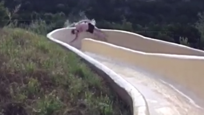 watch this viral video of a man falling off a water slide down a cliff watch this viral video of a man falling off a water slide down a cliff