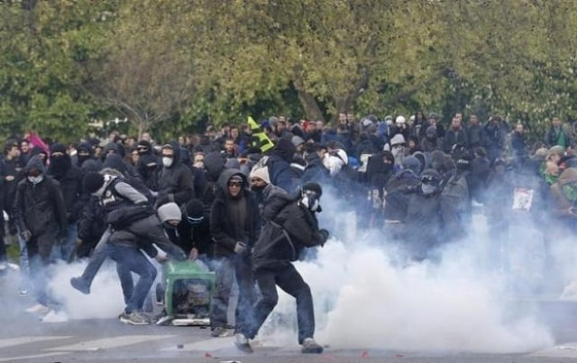 masked youths face off with french police during a demonstration photo reuters masked youths face off with french police during a demonstration photo reuters