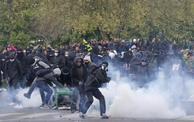 masked youths face off with french police during a demonstration photo reuters