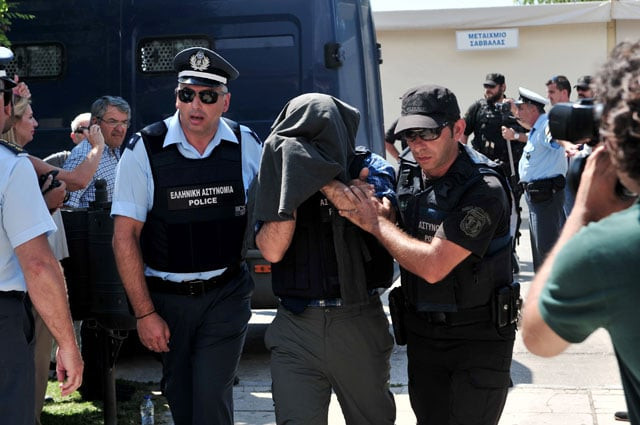 turkish officer escorted by greek police officers enters to the courthouse of alexandroupoli near the greek turkish border on 21 july 2016 during the trial of eight turkish military officers who fled to greece by helicopter after last week 039 s failed coup to open photo afp turkish officer escorted by greek police officers enters to the courthouse of alexandroupoli near the greek turkish border on 21 july 2016 during the trial of eight turkish military officers who fled to greece by helicopter after last week 039 s failed coup to open photo afp