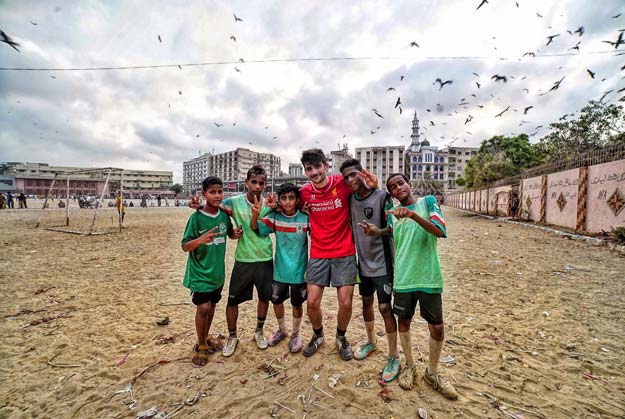 benjamin zand playing football with kids in lyari photo nofil naqvi bbc