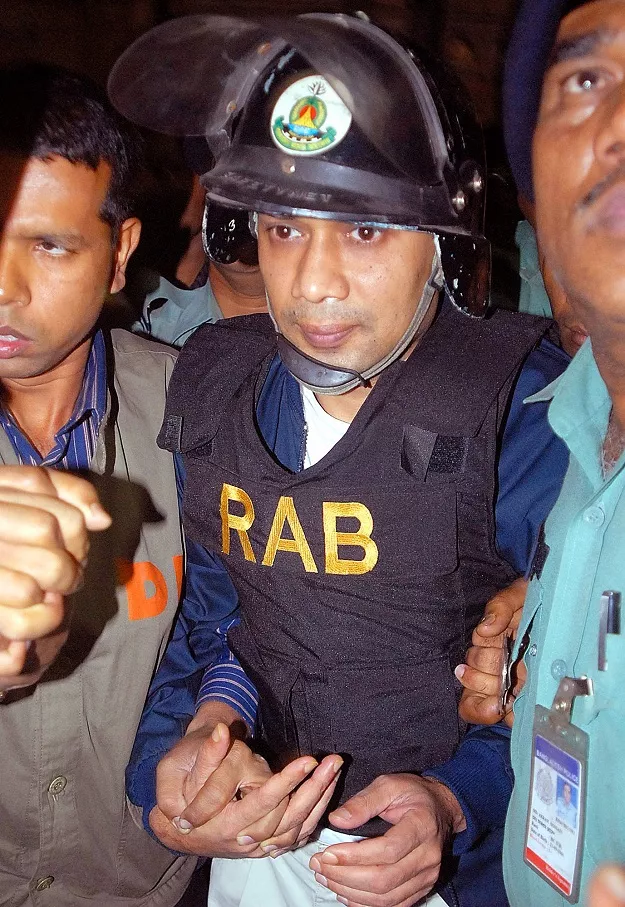 bangladeshi policemen as they escort tarique rahman photo afp bangladeshi policemen as they escort tarique rahman photo afp