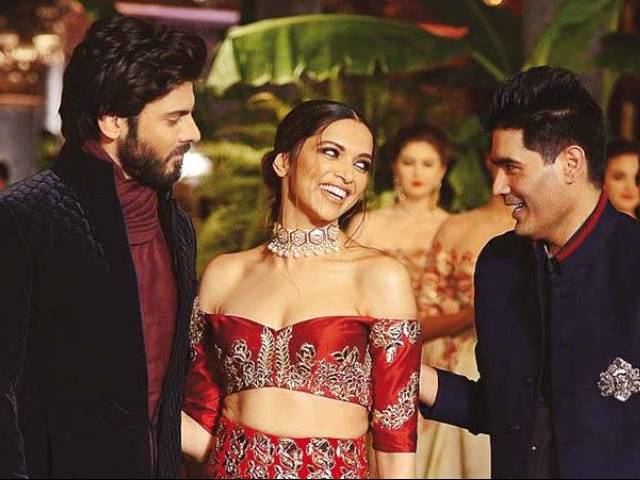While Fawad opened Malhotraâs show in a black Kurta and deep maroon pyjama, Deepika donned an off shoulder choli with intricate gold embroidery and a long-trailed lehenga. PHOTOS: FILE