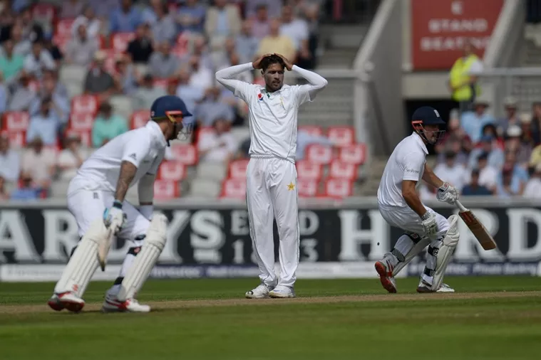pakistan 039 s bowler mohammad amir c holds his head as england 039 s captain alastair cook r and england 039 s alex hales run on the first day of the second cricket test match between england and pakistan at old trafford cricket ground in manchester england on july 22 2016 photo afp pakistan 039 s bowler mohammad amir c holds his head as england 039 s captain alastair cook r and england 039 s alex hales run on the first day of the second cricket test match between england and pakistan at old trafford cricket ground in manchester england on july 22 2016 photo afp