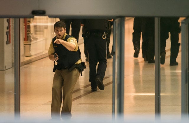 police secures the area inside a shopping center in munich on july 22 2016 following a shooting photo afp