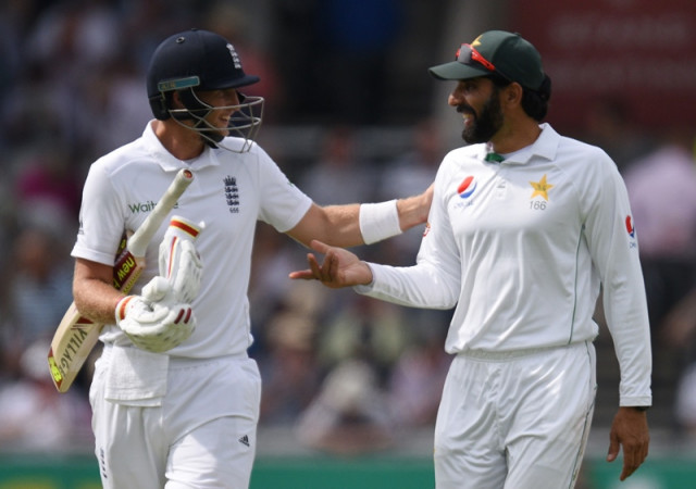 joe root chats with misbahul haq r as they walk off for tea at old trafford cricket ground in manchester england on july 23 2016 photo afp joe root chats with misbahul haq r as they walk off for tea at old trafford cricket ground in manchester england on july 23 2016 photo afp