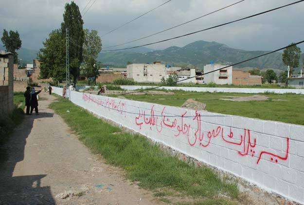 workers mark the edges of the patch of ground where the house where al qaeda leader osama bin laden was killed once stood in abbottabad on july 23 2016 photo afp