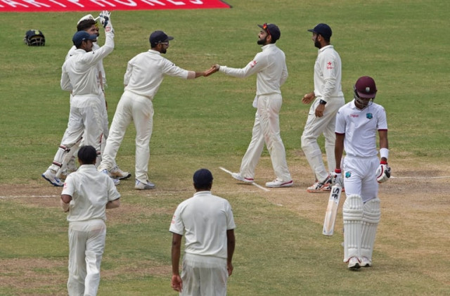 india cricketer virat kohli 3rd r celebrates with his team as west indies cricketer roston chase r walks off the field during day three of the cricket test match between west indies and india july 23 2016 at sir vivian richards stadium in st john 039 s antigua photo afp india cricketer virat kohli 3rd r celebrates with his team as west indies cricketer roston chase r walks off the field during day three of the cricket test match between west indies and india july 23 2016 at sir vivian richards stadium in st john 039 s antigua photo afp