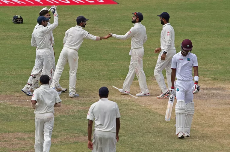 india cricketer virat kohli 3rd r celebrates with his team as west indies cricketer roston chase r walks off the field during day three of the cricket test match between west indies and india july 23 2016 at sir vivian richards stadium in st john 039 s antigua photo afp india cricketer virat kohli 3rd r celebrates with his team as west indies cricketer roston chase r walks off the field during day three of the cricket test match between west indies and india july 23 2016 at sir vivian richards stadium in st john 039 s antigua photo afp