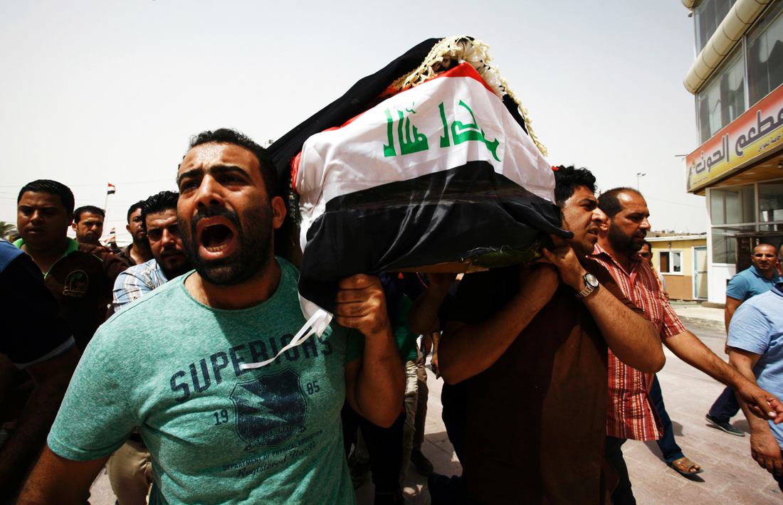 iraqi men carry a coffin in the holy iraqi city of najaf on july 3 2016 during a funeral procession for the victims of a suicide bombing that ripped through baghdad 039 s busy shopping district of karrada photo afp