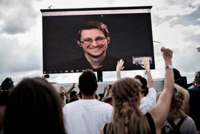 american whistleblower edward snowden is seen on a screen as he delivers a speech during the roskilde festival in roskilde denmark june 28 2016 scanpix denmark mathias loevgreen bojesen via reuters american whistleblower edward snowden is seen on a screen as he delivers a speech during the roskilde festival in roskilde denmark june 28 2016 scanpix denmark mathias loevgreen bojesen via reuters