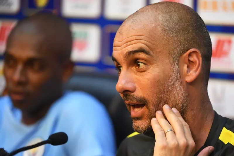 pep guardiola speaks as fernandinho listens during a press conference in beijing on july 24 2016 photo afp pep guardiola speaks as fernandinho listens during a press conference in beijing on july 24 2016 photo afp