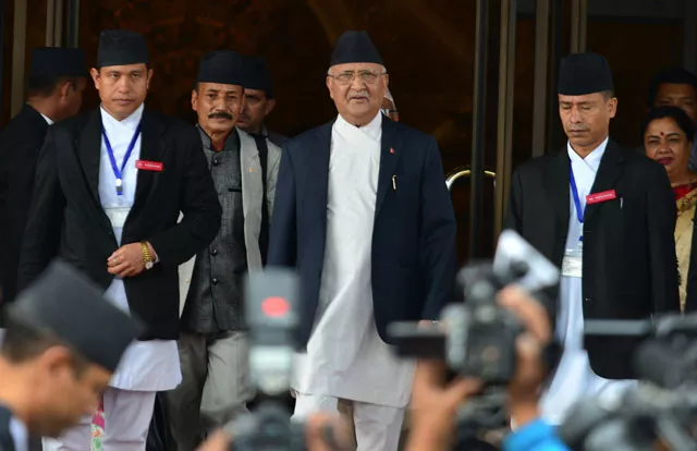 in this photograph taken on july 21 2016 nepalese prime minister kp oli sharma c leaves the parliament building in kathmandu photo afp in this photograph taken on july 21 2016 nepalese prime minister kp oli sharma c leaves the parliament building in kathmandu photo afp