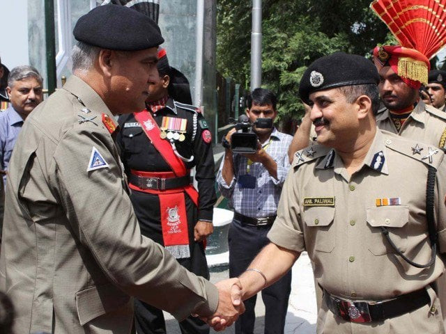 in this file photo dg punjab rangers sahkes hand with the indian bsf official at wagah border photo afp in this file photo dg punjab rangers sahkes hand with the indian bsf official at wagah border photo afp