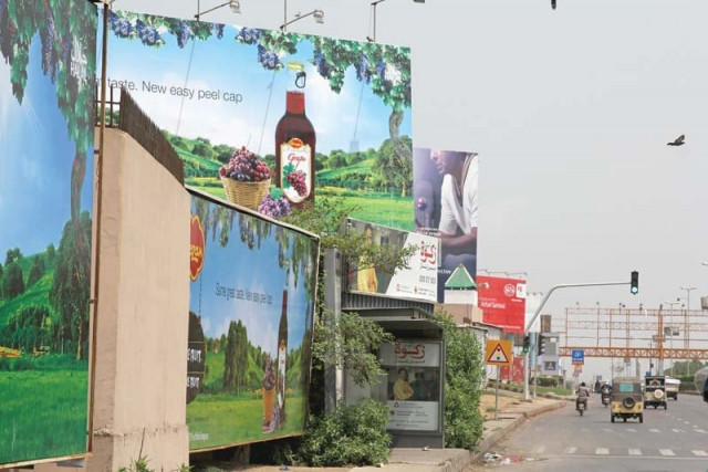 a large number of billboards are still present on karsaz road photo aysha saleem express a large number of billboards are still present on karsaz road photo aysha saleem express