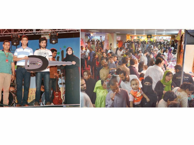 winner of a motorcycle in the lucky draw receives key at expo family festival 2016 people throng various stalls put up in the festival photos express winner of a motorcycle in the lucky draw receives key at expo family festival 2016 people throng various stalls put up in the festival photos express
