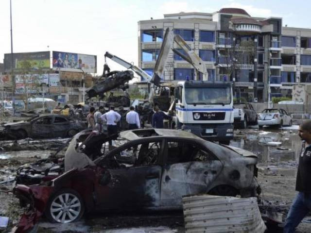 iraqi security forces and civilians gather at the site of a car bomb attack in baghdad october 21 2014 photo reuters iraqi security forces and civilians gather at the site of a car bomb attack in baghdad october 21 2014 photo reuters