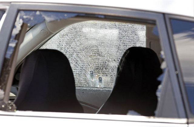 a car hit by gunfire sits outside of club blu where two people were killed and at least 15 wounded on july 25 2016 in fort myers florida photo afp