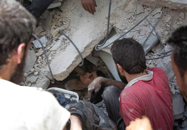 syrian civil defence volunteers known as the white helmets dig out a young boy trapped under the rubble of destroyed buildings following reported air strikes on the rebel held neighbourhood of al mashhad in the northern city of aleppo on july 25 2016 photo afp syrian civil defence volunteers known as the white helmets dig out a young boy trapped under the rubble of destroyed buildings following reported air strikes on the rebel held neighbourhood of al mashhad in the northern city of aleppo on july 25 2016 photo afp