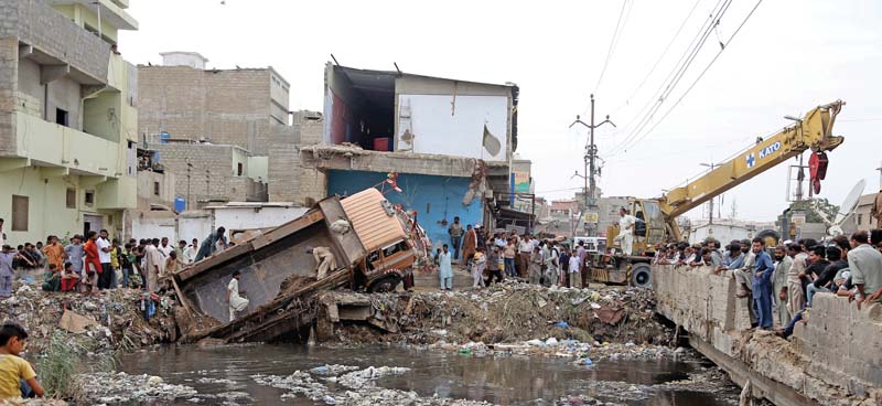 the gujjar nullah is set to be cleared of encroachments within the next six months with officials working round the clock to ensure its cleaning photo aysha saleem express