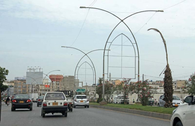 the skins of billboards on korangi road left have been removed but sharae faisal right continues to be dotted with hoardings photos ayesha mir express the skins of billboards on korangi road left have been removed but sharae faisal right continues to be dotted with hoardings photos ayesha mir express