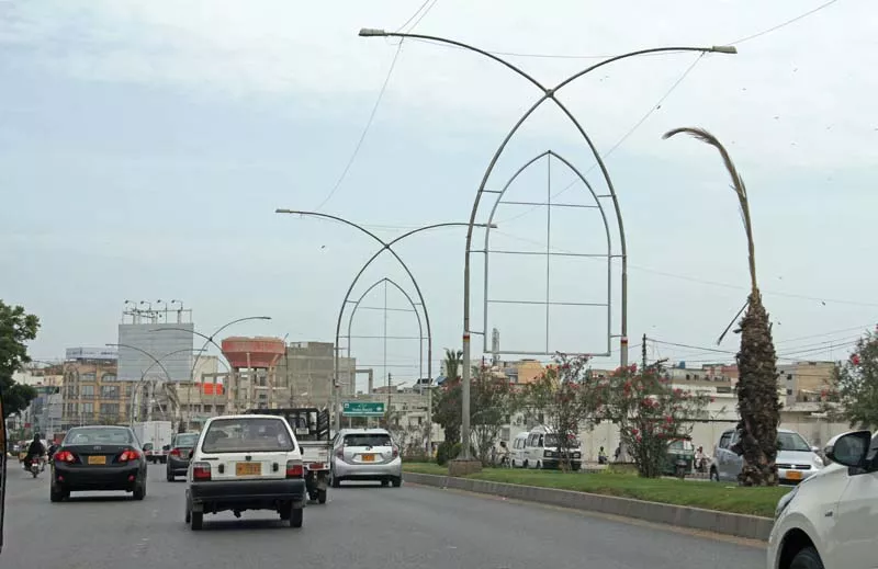 the skins of billboards on korangi road left have been removed but sharae faisal right continues to be dotted with hoardings photos ayesha mir express the skins of billboards on korangi road left have been removed but sharae faisal right continues to be dotted with hoardings photos ayesha mir express