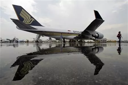 singapore airlines 039 sia boeing 747 400 passenger jet is reflected in a puddle at the singapore airshow in singapore photo reuters singapore airlines 039 sia boeing 747 400 passenger jet is reflected in a puddle at the singapore airshow in singapore photo reuters