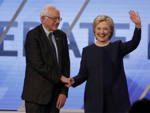 bernie sanders shakes hands with hillary clinton photo afp