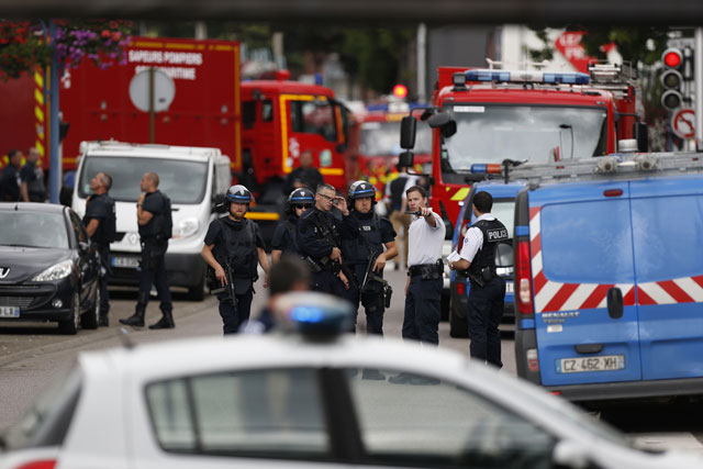 french police officers and fire engine arrive at the scene of a hostage taking at a church in saint etienne du rouvray northern france on july 26 2016 that left the priest dead photo afp