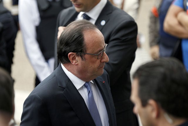 french president francois hollande stands outside the saint etienne du rouvray 039 s city hall after holding a press conference following a hostage taking at a church of the town on july 26 2016 photo afp