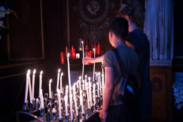 people light candles on july 26 2016 in tours 039 cathedral central france after a mass celebrated in tribute to the priest killed in saint etienne du rouvray photo afp people light candles on july 26 2016 in tours 039 cathedral central france after a mass celebrated in tribute to the priest killed in saint etienne du rouvray photo afp