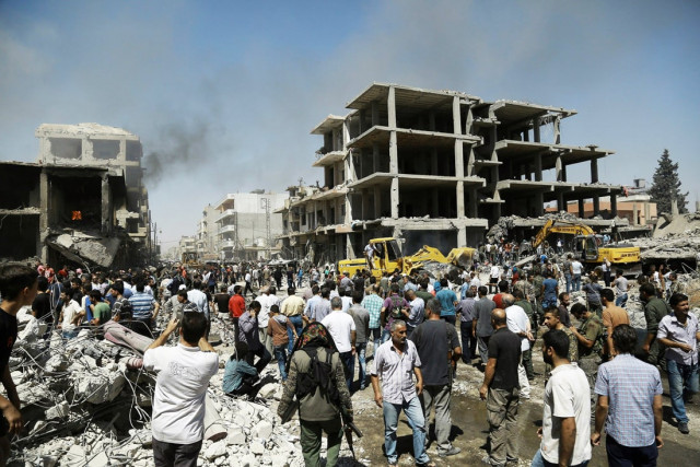 syrians gather at the site of a bomb attack in syria 039 s northeastern city of qamishli on july 27 2016 photo afp syrians gather at the site of a bomb attack in syria 039 s northeastern city of qamishli on july 27 2016 photo afp