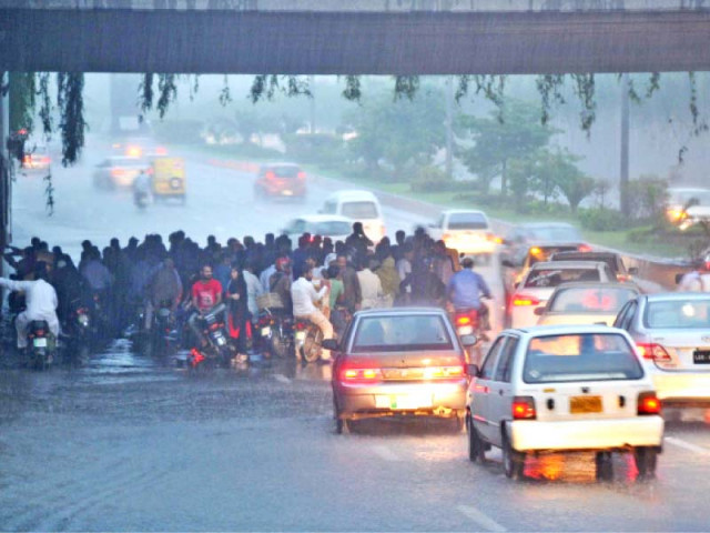 commuters take cover under an underpass after rain struck early in the evening photo express commuters take cover under an underpass after rain struck early in the evening photo express