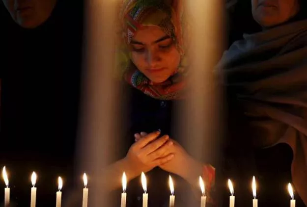 a girl prays for the victims of a militant attack on the bacha khan university during a candle light vigil in peshawar pakistan january 20 2016 photo reuters a girl prays for the victims of a militant attack on the bacha khan university during a candle light vigil in peshawar pakistan january 20 2016 photo reuters