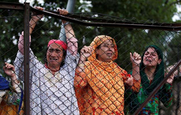 kashmiri women mourn the death of burhan wani during his funeral in tral south of srinagar photo reuters