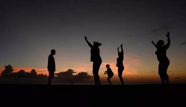 women exercise in front of a trainer l as the sun sets near kensington oval photo reuters women exercise in front of a trainer l as the sun sets near kensington oval photo reuters